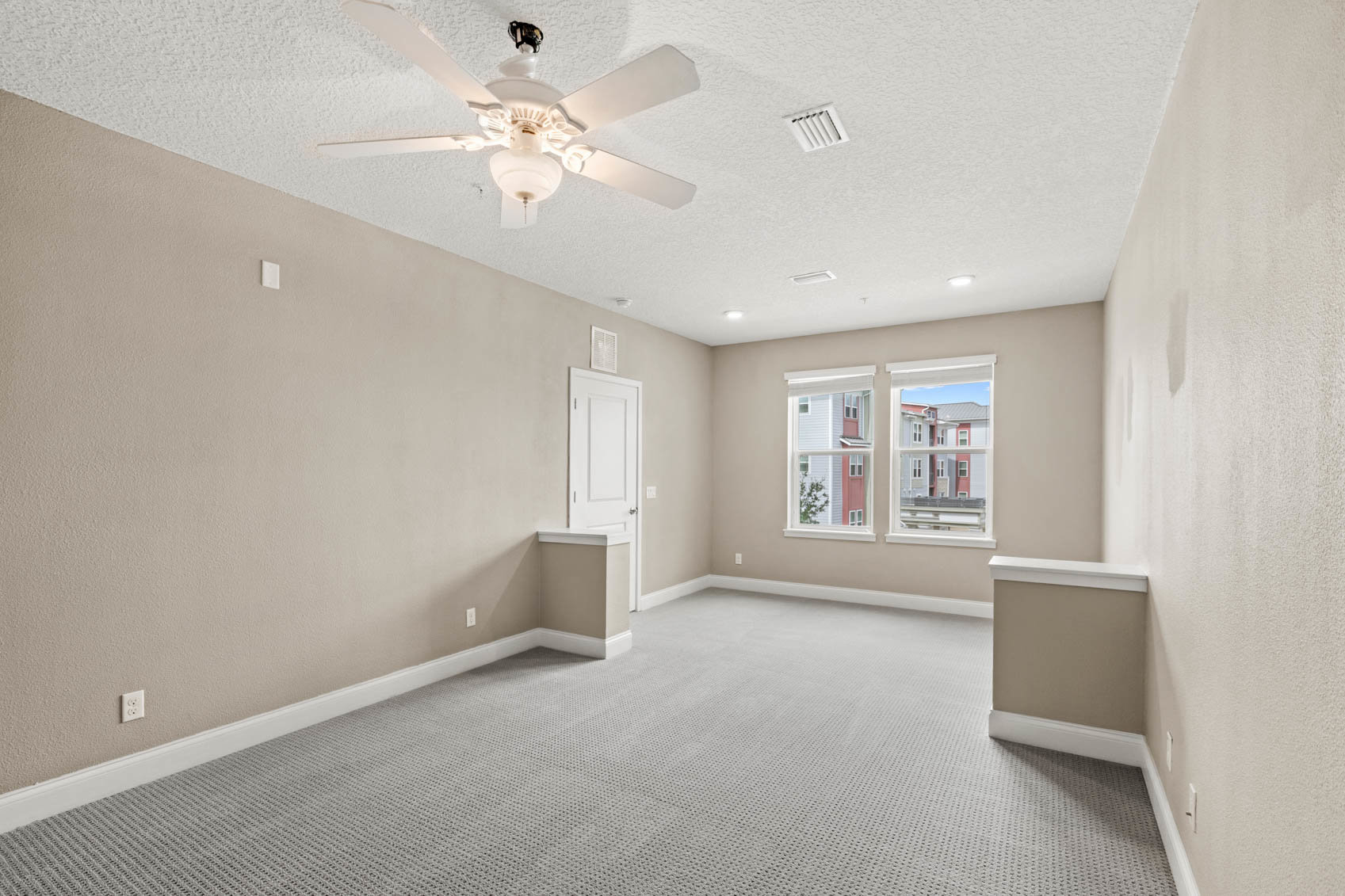 bedroom with window to look out and half walls